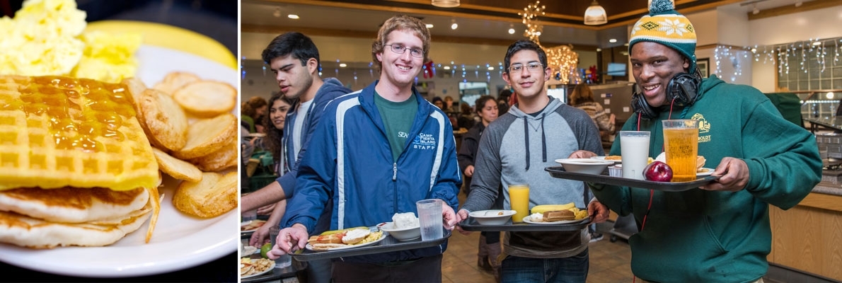 three students holding trays of food at the pancake breakfast